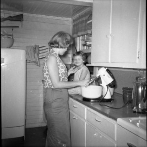 Woman and young girl with mixer at 4-H electric project
