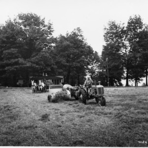Tractor-powered with hay balers and mule-drawn wagon