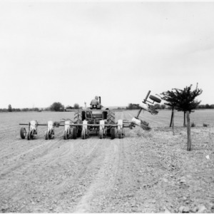Man operating agricultural machinery