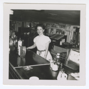 Woman Behind a Deli Counter