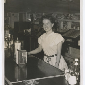 Woman Behind a Deli Counter