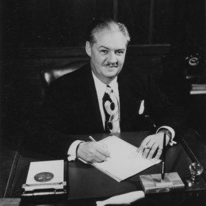 Dean Malcolm E. Campbell at desk