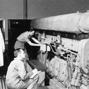 W. H. Kite, Jr., Donald D. McMillan, and George K. Hanner operating Cooper Bessemer diesel engine, model GSB-8-DR