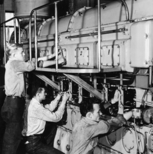 W. H. Kite, Jr. and students operating Fairbanks-Moore Model 38D 8 1/8 Opposed Piston diesel engine