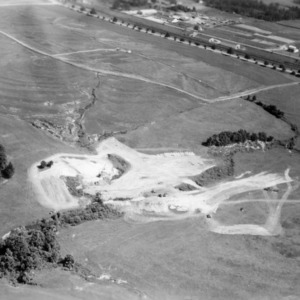 Aerial view of dairy farm before construction of dam