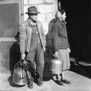 Dairy workers with equipment
