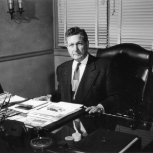 Chancellor John W. Harrelson at desk