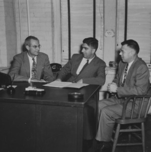 Dr. R. E. Fisher of Cambridge University and others in J. A. Rigney's office