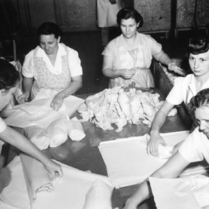 Women packing chickens at broilers dressing plant