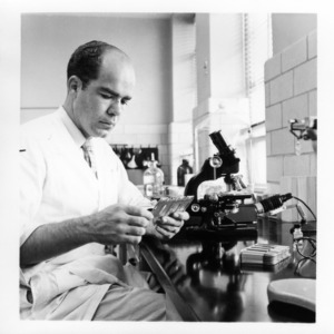 Dr. Henry W. Garren in poultry disease lab