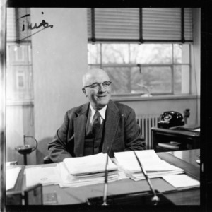 Dean J. Harold Lampe at desk
