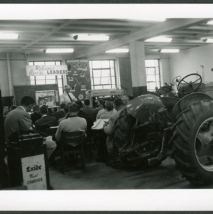 Tractor School Agricultural Engineering Building; Ferguson or Glover with three or four boys examining tractor or parts; 4-H Department, Fred Wagoner