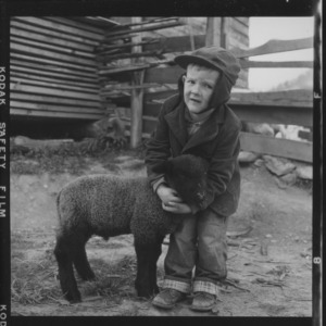 Child with lamb