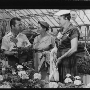 Farm and Home Week; Two women at floral greenhouse