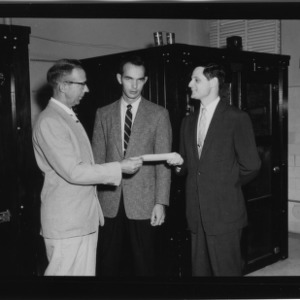 Bundy Belk Presenting $1000 check to Dr. H. L. Bumgardner and Dr. Gloyener