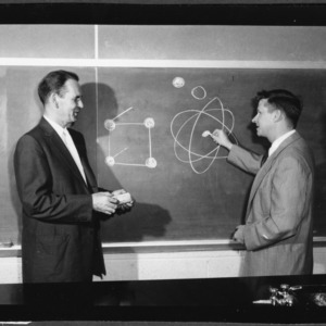 Dr. Walter J. Peterson with graduate student Harold A. Lomonds