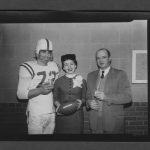 Connie Elizabeth Hobby, Miss North Carolina Dairy Princess with Coach Earl Edward and football players