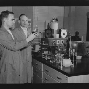 Dr. Donald E. Moreland and other in field crops laboratory