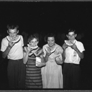 Watermelon Cutting, left to right: Gordon Ball, Buncombe County; Linda Dillinger, Yancey County; Viam Duncan, Yancey County; Charles R. Aldus, Johnson County