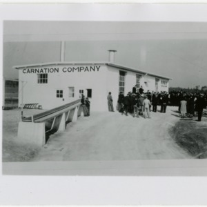 Group meeting outside of Carnation Company factory