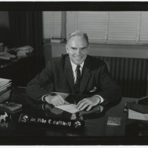Chancellor John Caldwell at desk