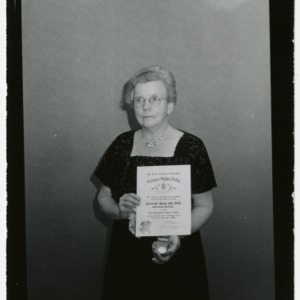 Gertrude Cox with certificate at Gamma Sigma Delta Honors Banquet