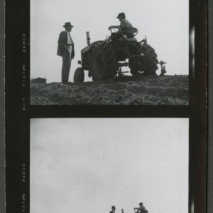 Farmer on tractor talking to agent