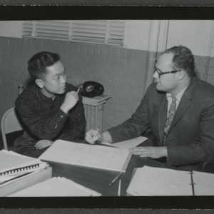 W. O. Daggett and student at desk