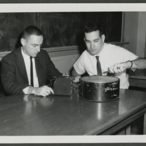 Two students with electronic device