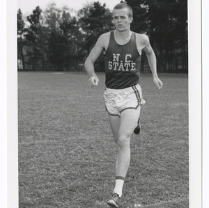 Action shot of varsity track athlete in 1962